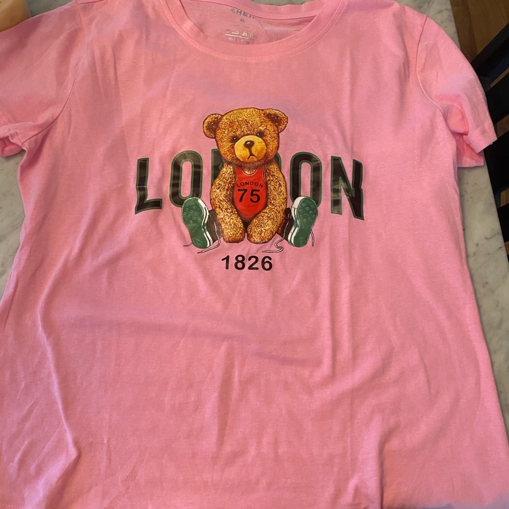 Brand new shein shirt. Size is xl. It is pink.